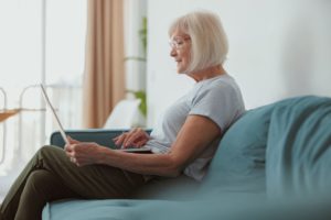 modern old lady using laptop computer at home 2022 02 17 17 45 09 utc 1